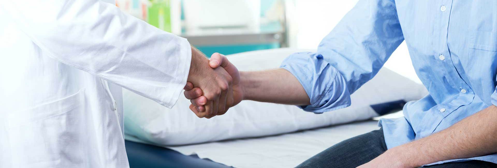 Doctor shaking hands with the patient